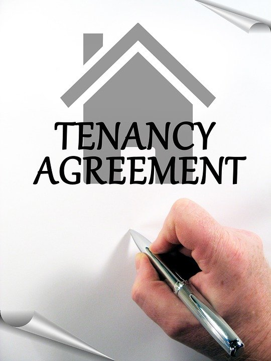 person signing a tenancy agreement  